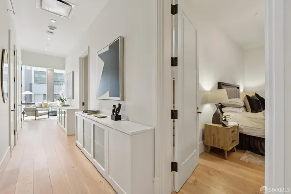 a bathroom with a granite countertop sink mirror vanity and toilet
