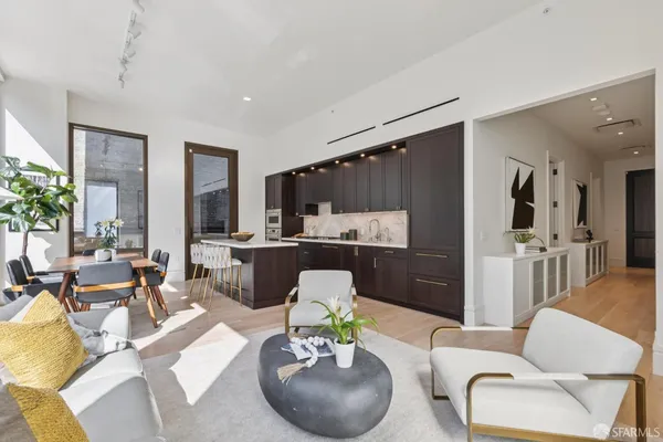 a kitchen with lots of counter top space and living room