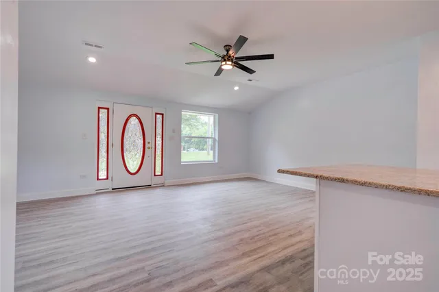 a view of a livingroom with a stove top oven