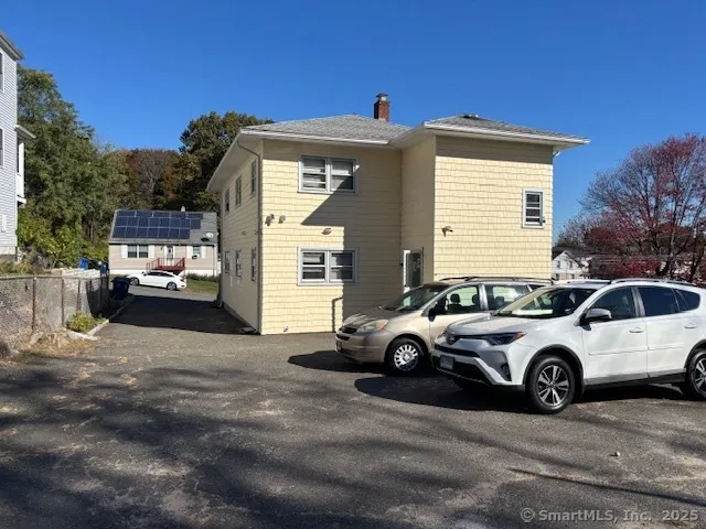 a car parked in front of a house