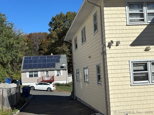 a view of a patio with couches chairs and potted plants