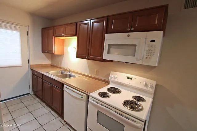 a kitchen with a stove and a microwave