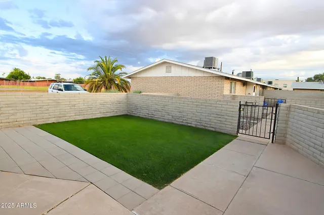 a view of a backyard with a garden