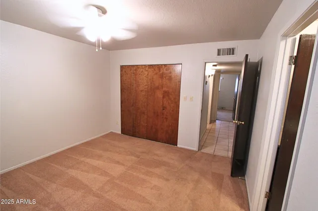 a view of hallway with a mirror