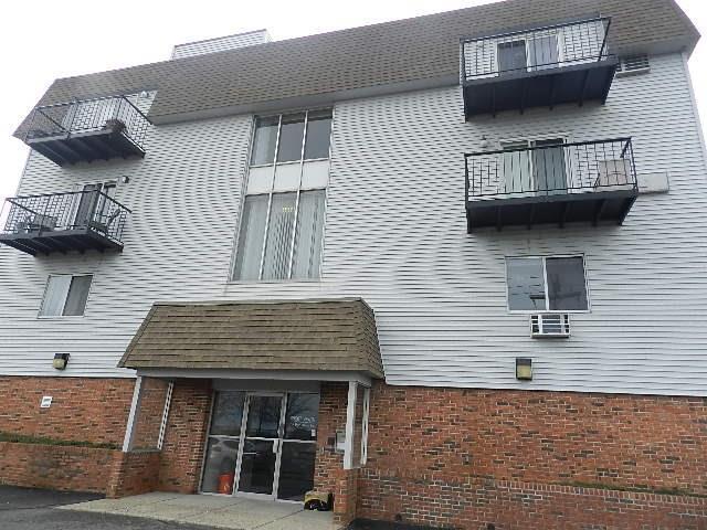 115 Short Beach Road, Unit 209 Stratford, CT 06615 - Photo 1 of 1 a front view of a house with a window