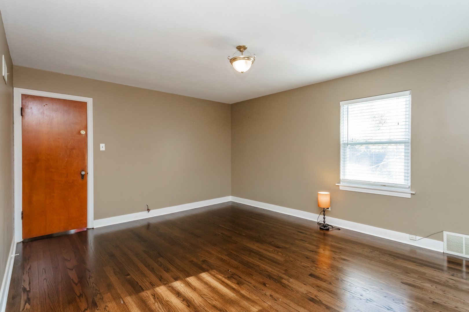 552 East Parkway Road Riverside, IL 60546 - Photo 14 of 25 an empty room with wooden floor and window