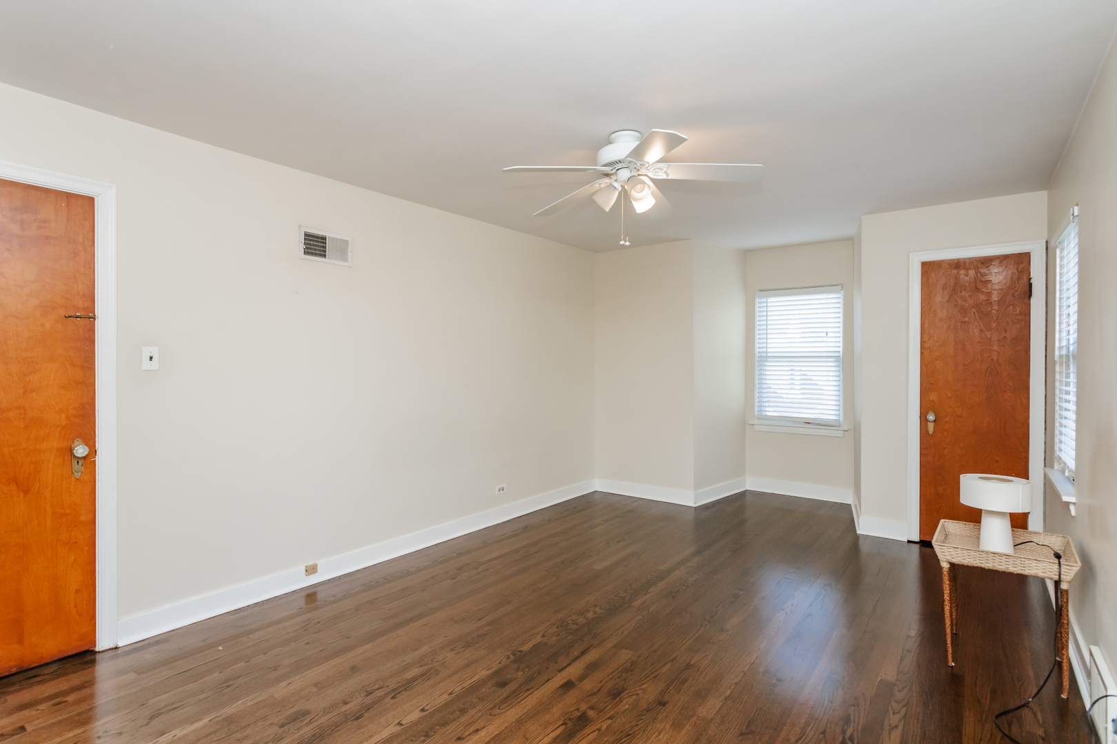 552 East Parkway Road Riverside, IL 60546 - Photo 18 of 25 an empty room with wooden floor fan and windows