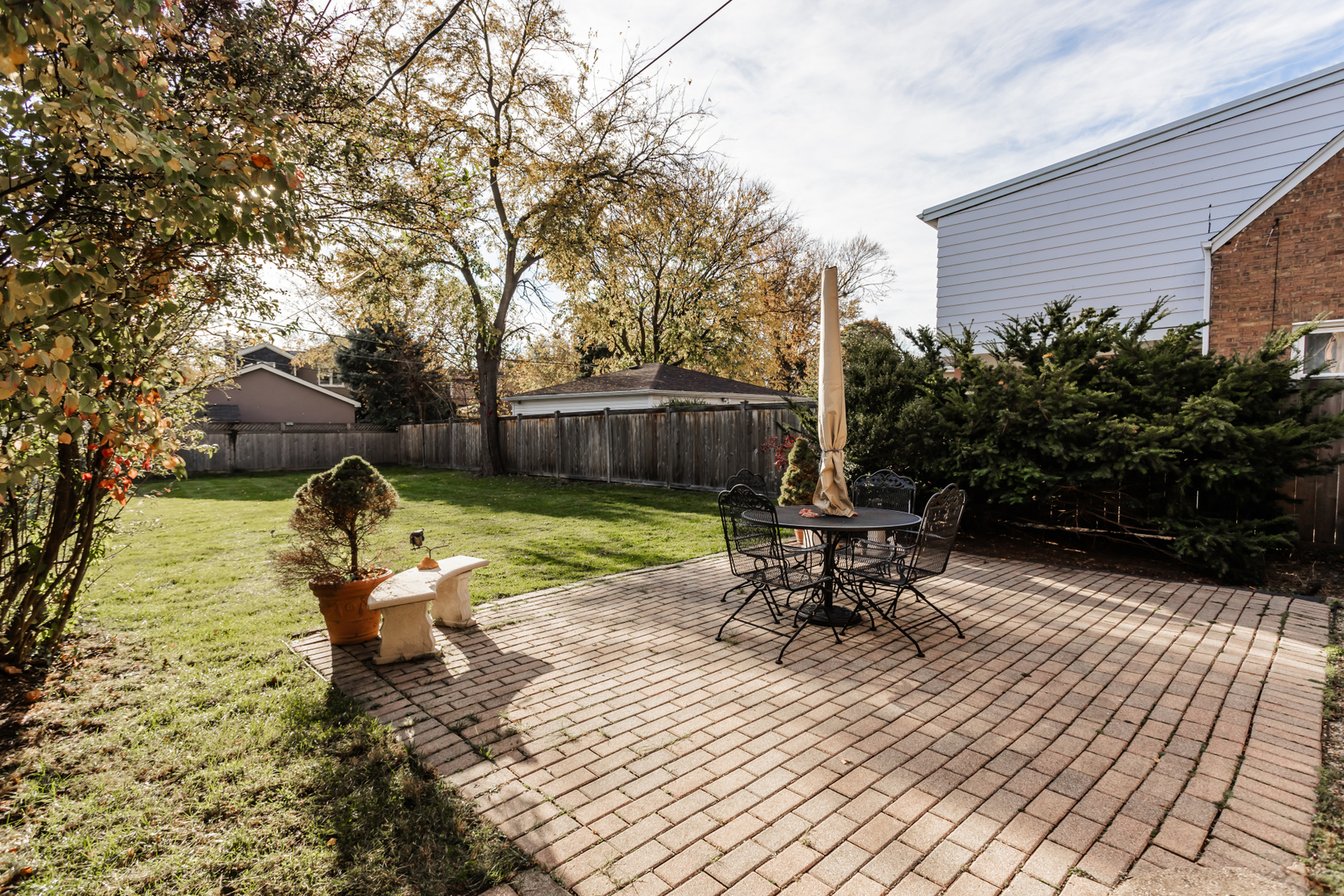 552 East Parkway Road Riverside, IL 60546 - Photo 19 of 25 a view of a patio with a table chairs and a yard