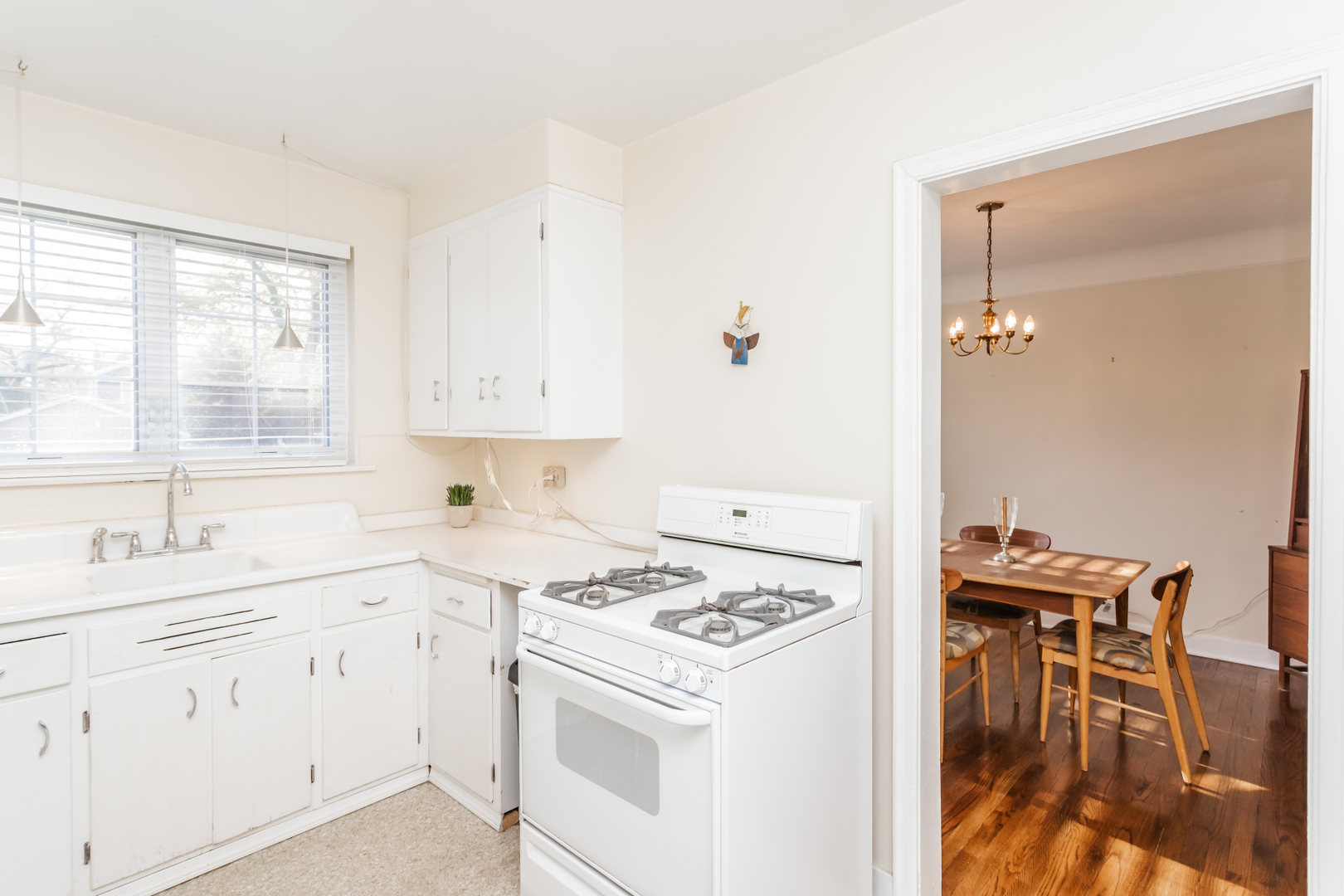 552 East Parkway Road Riverside, IL 60546 - Photo 10 of 25 a kitchen with a stove a sink and a window