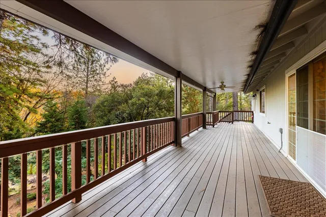 a view of balcony with wooden floor