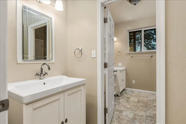 a bathroom with a sink and a mirror