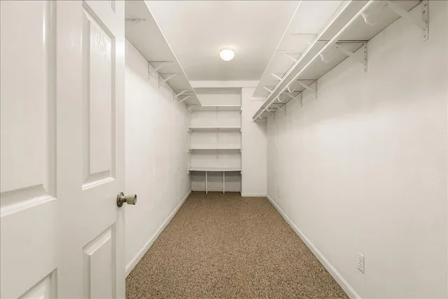 a view of a hallway with closet