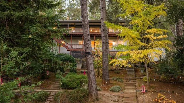 a front view of a house with trees