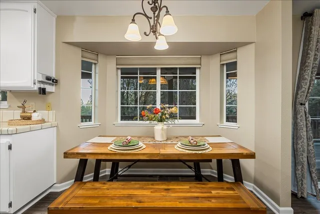 a view of a dining room with furniture window and outside view