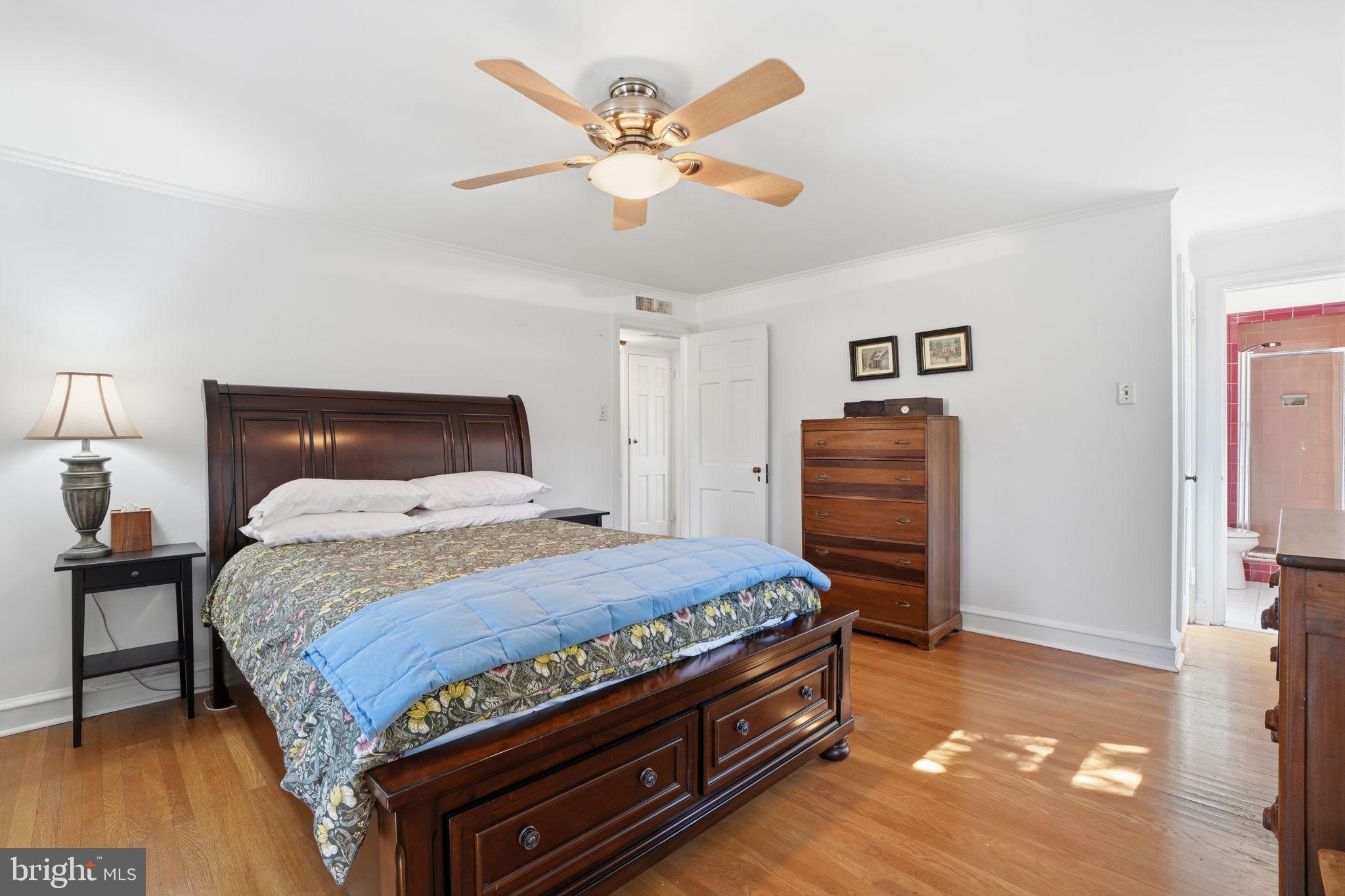 7791 Spring Avenue Elkins Park, PA 19027 - Photo 15 of 33 a bedroom with a bed and a dresser in it