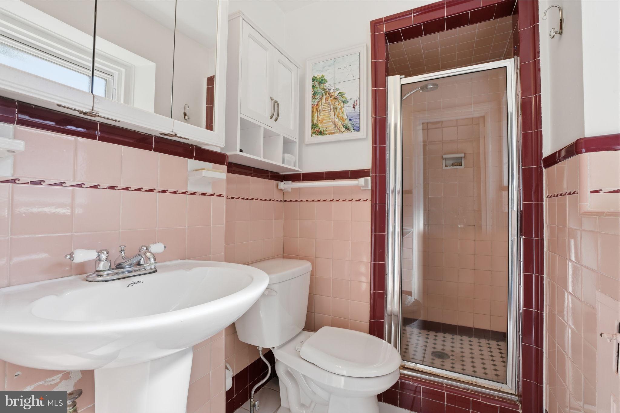 7791 Spring Avenue Elkins Park, PA 19027 - Photo 17 of 33 a bathroom with a sink a toilet and shower