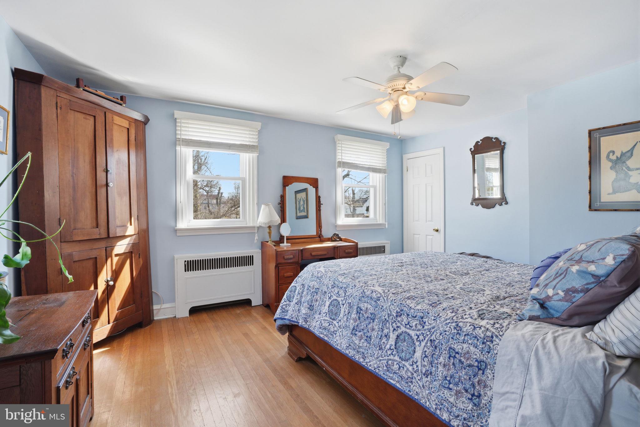 7791 Spring Avenue Elkins Park, PA 19027 - Photo 20 of 33 a bedroom with a bed and a chandelier