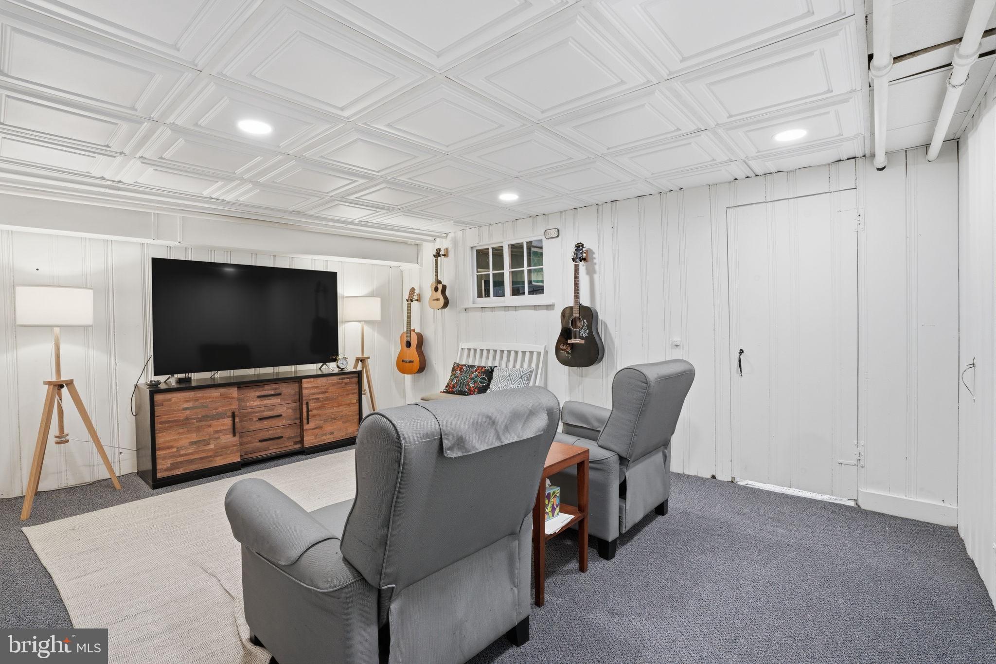 7791 Spring Avenue Elkins Park, PA 19027 - Photo 24 of 33 a living room with furniture and a flat screen tv
