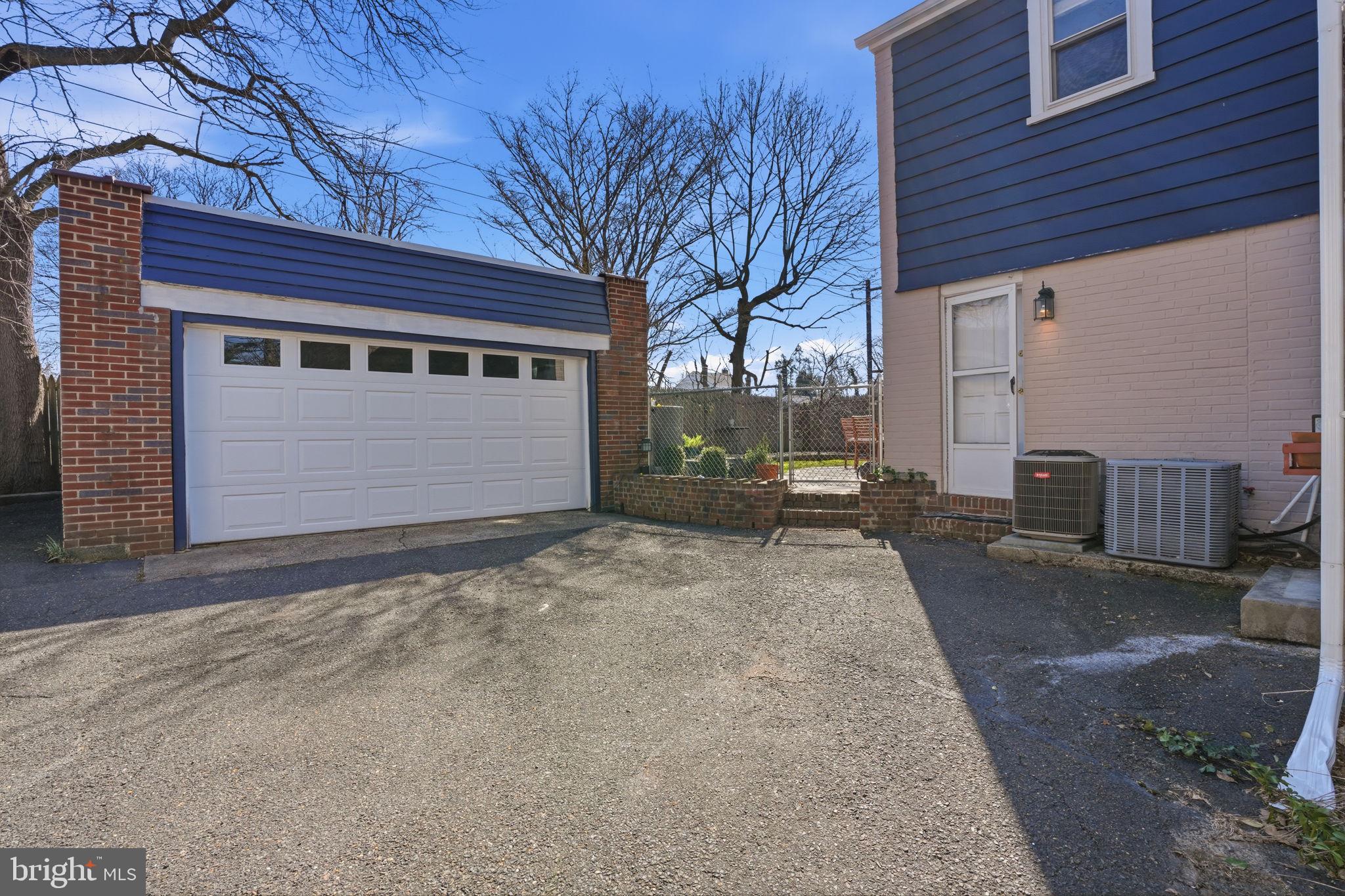 7791 Spring Avenue Elkins Park, PA 19027 - Photo 31 of 33 a front view of a house with a yard and garage