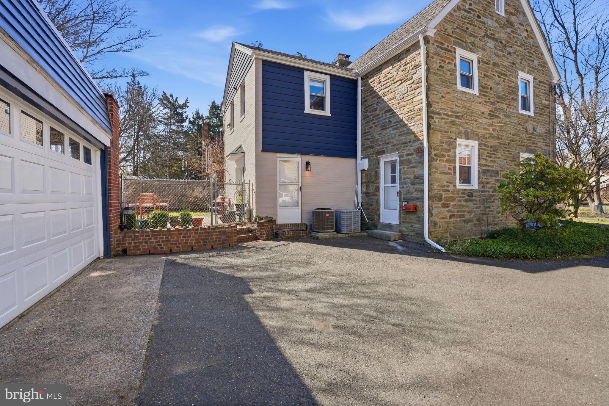 7791 Spring Avenue Elkins Park, PA 19027 - Photo 32 of 33 a view of a brick house with many windows