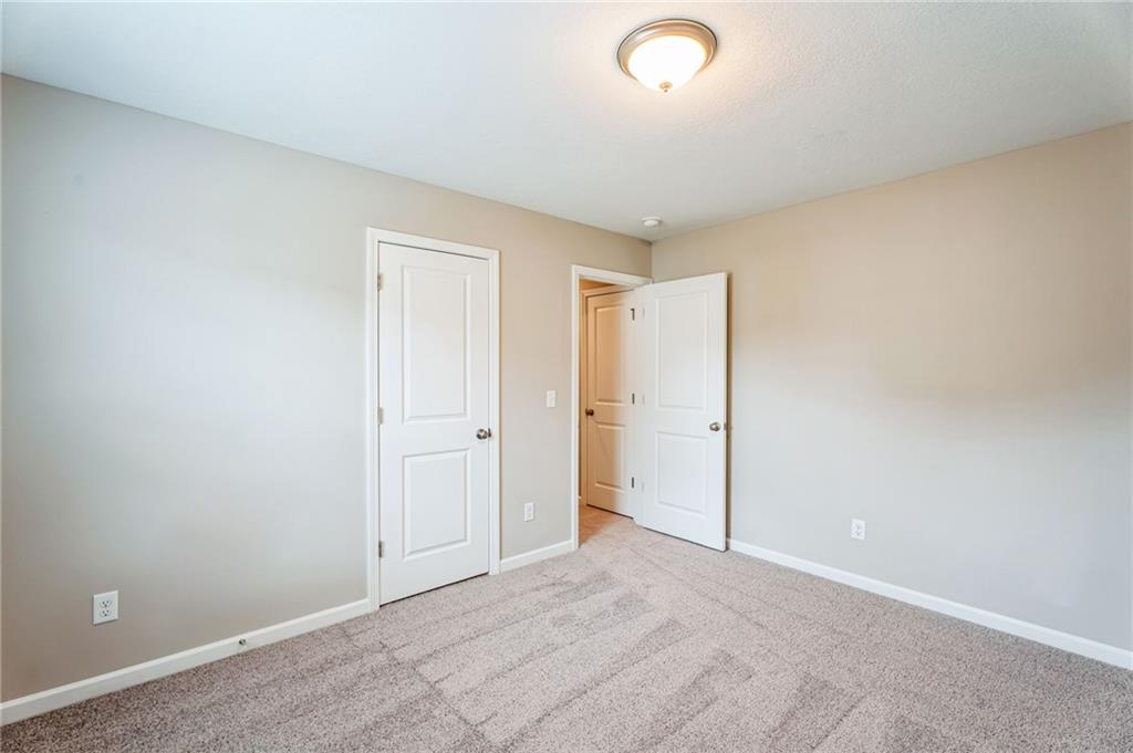 23 Whiterock Road Phenix City, AL 36869 - Photo 27 of 29 Unfurnished bedroom featuring baseboards and carpet