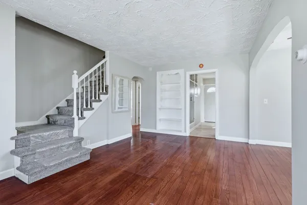 a view of an entryway with wooden floor