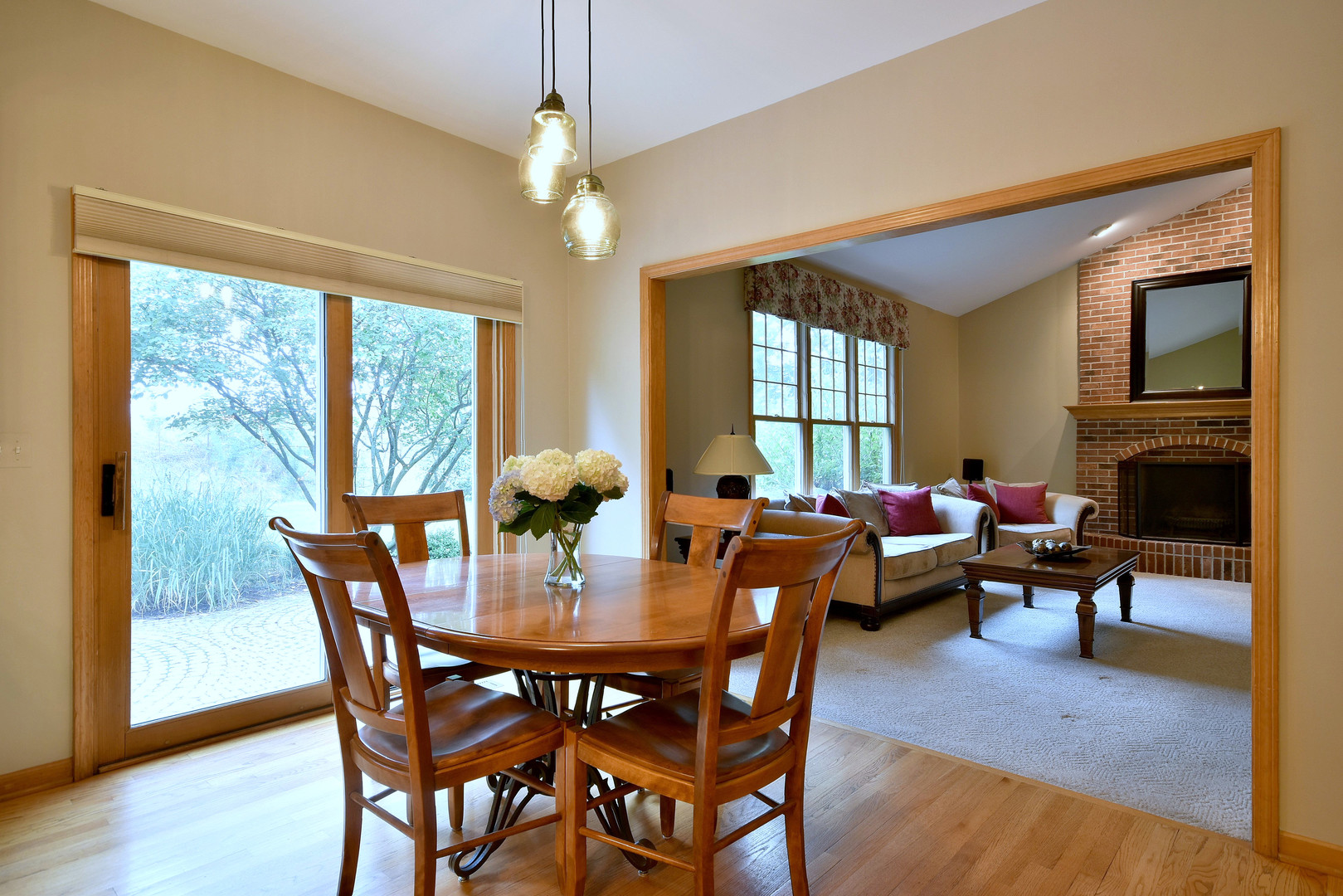 448 Lewis Road Geneva, IL 60134 - Photo 11 of 52 a view of a dining room with furniture window and wooden floor