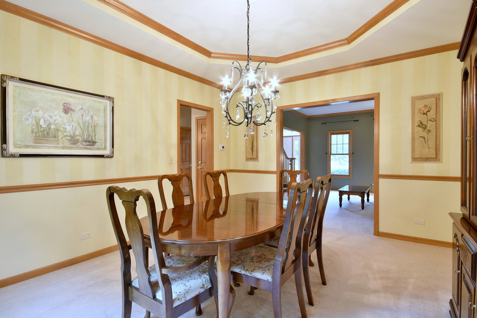 448 Lewis Road Geneva, IL 60134 - Photo 16 of 52 a view of a dining room with furniture and chandelier