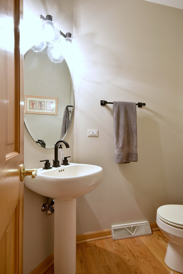 448 Lewis Road Geneva, IL 60134 - Photo 18 of 52 a bathroom with a sink a toilet and mirror
