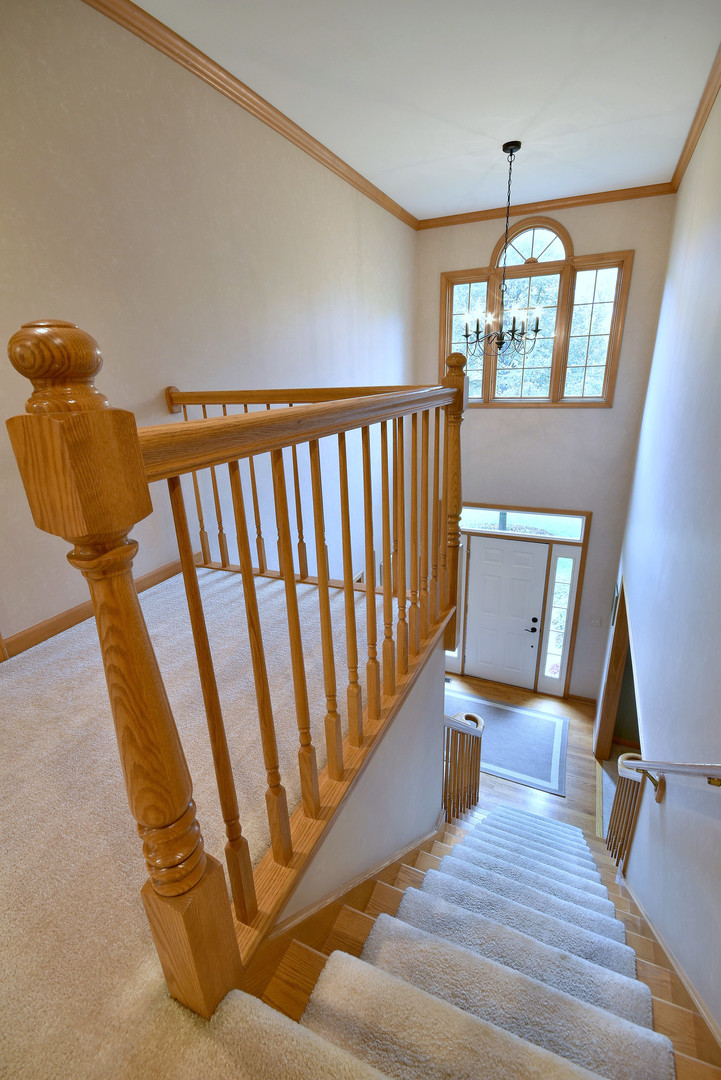 448 Lewis Road Geneva, IL 60134 - Photo 21 of 52 a view of wooden floor and chair in a room