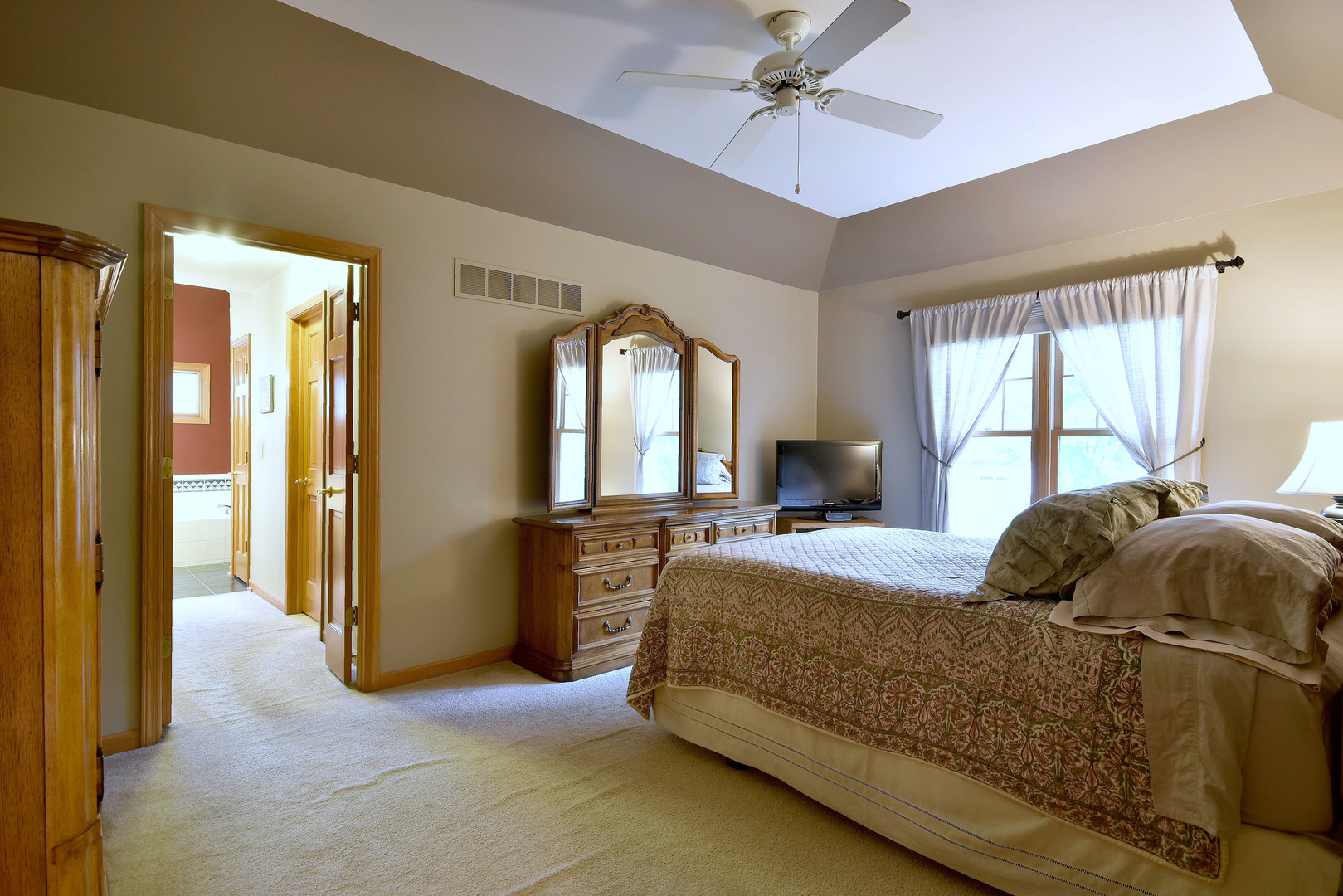 448 Lewis Road Geneva, IL 60134 - Photo 23 of 52 a bedroom with a bed and a chandelier