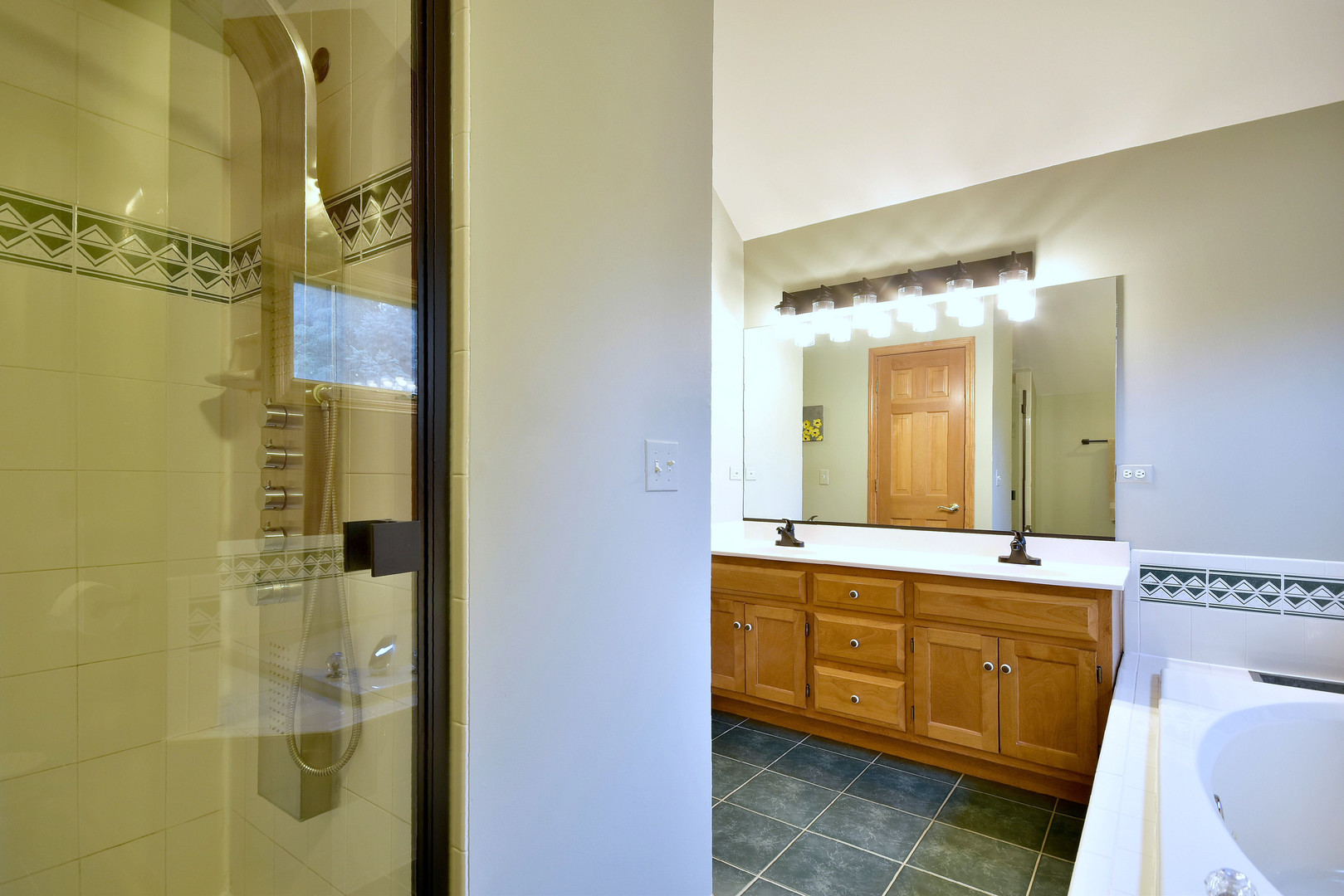 448 Lewis Road Geneva, IL 60134 - Photo 26 of 52 a bathroom with a double vanity sink and mirror with shower