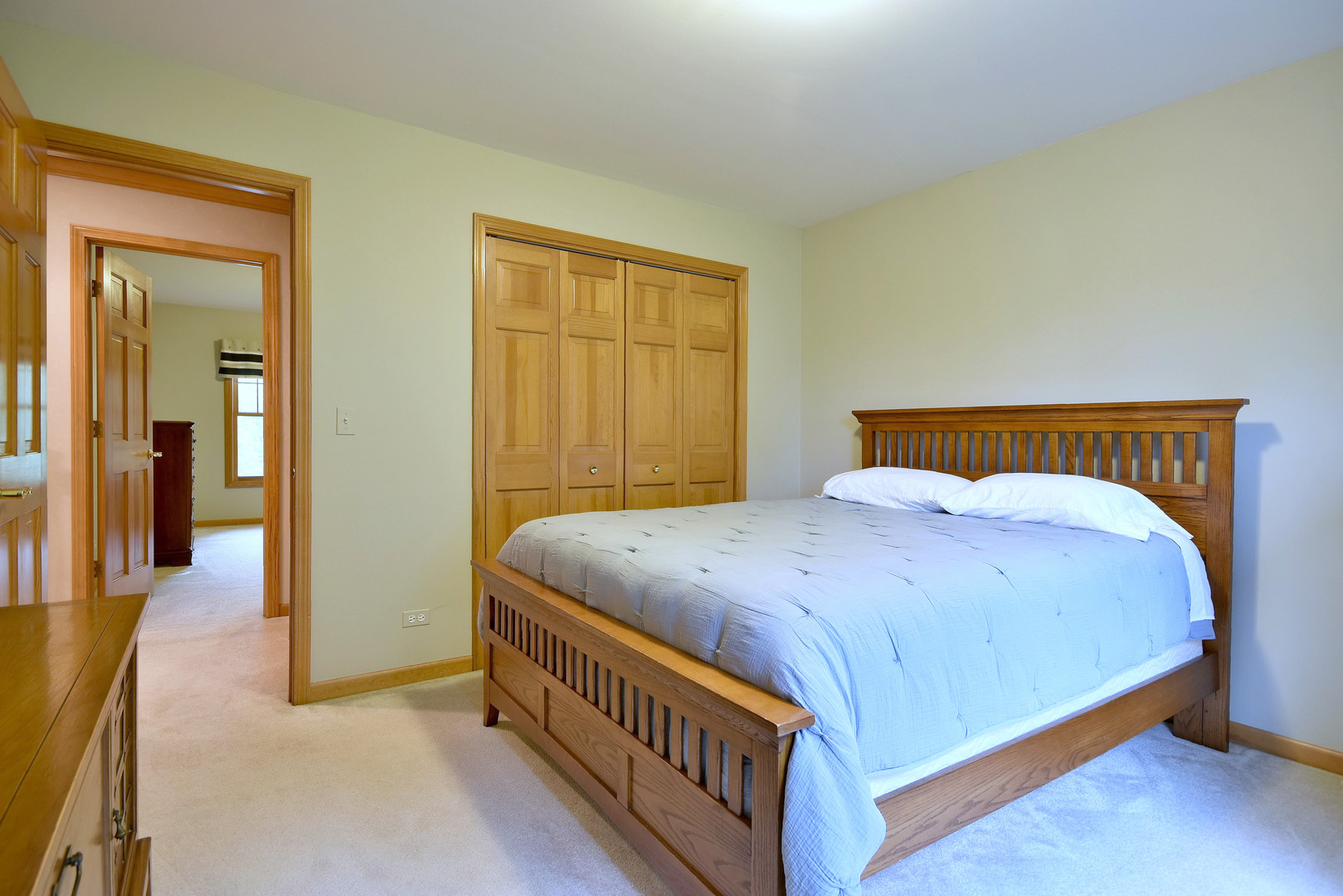 448 Lewis Road Geneva, IL 60134 - Photo 31 of 52 a bedroom with a bed and wooden floor
