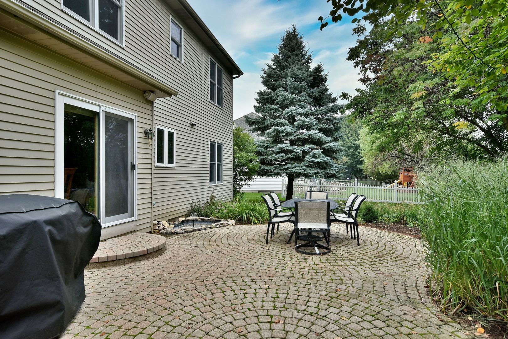 448 Lewis Road Geneva, IL 60134 - Photo 41 of 52 a view of a chair and table in the back yard of the house