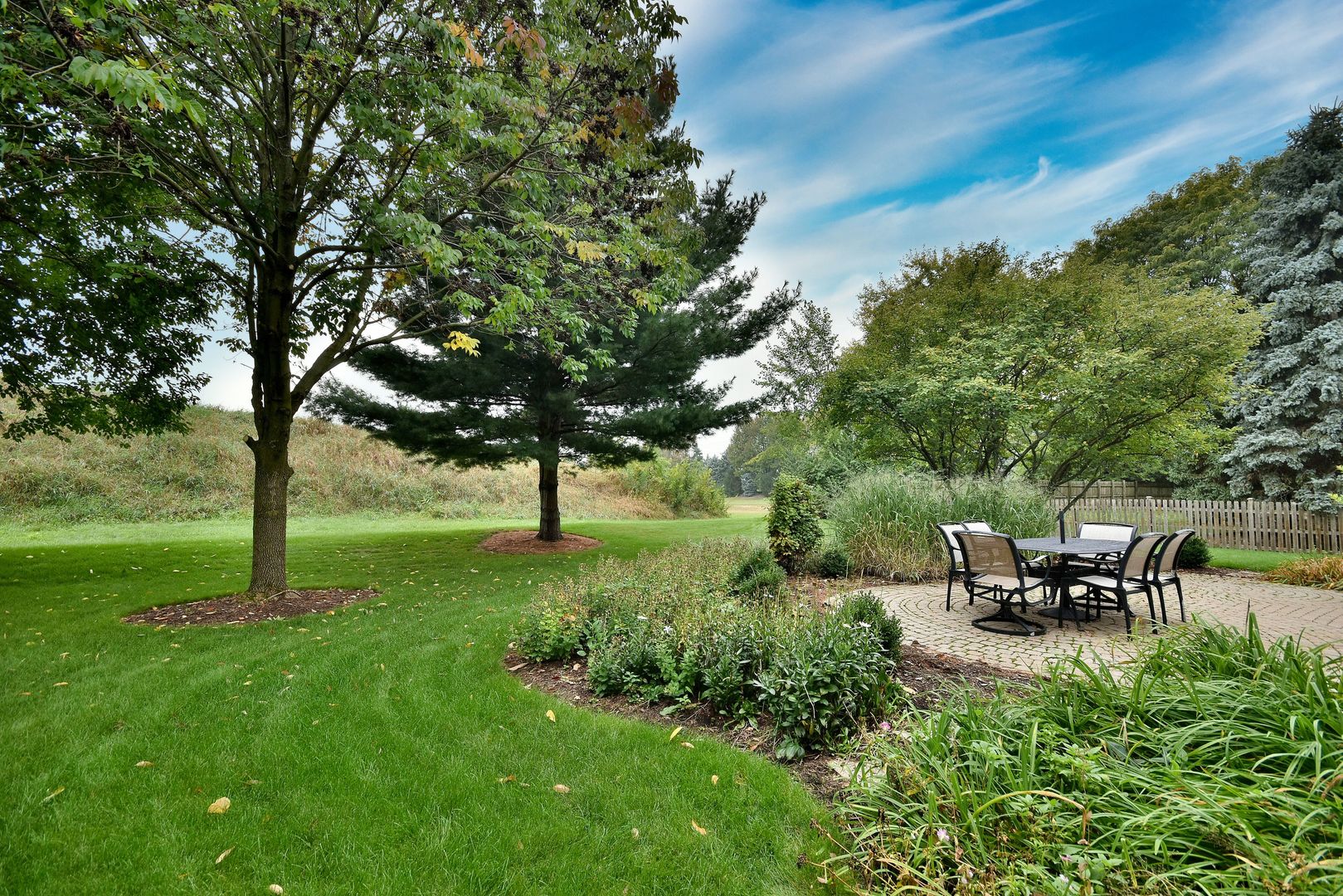 448 Lewis Road Geneva, IL 60134 - Photo 42 of 52 a view of a table and chairs in the garden