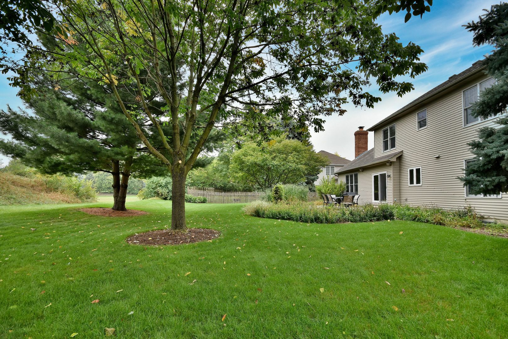 448 Lewis Road Geneva, IL 60134 - Photo 44 of 52 a view of backyard with a garden and trees