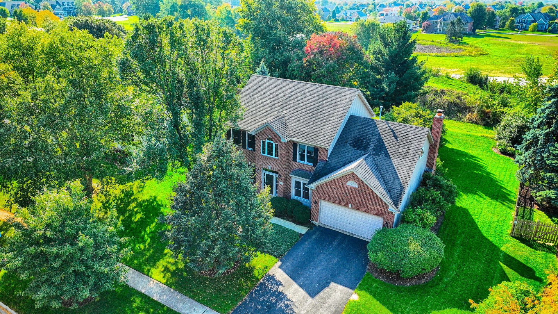 448 Lewis Road Geneva, IL 60134 - Photo 47 of 52 an aerial view of a house with pool yard and outdoor seating