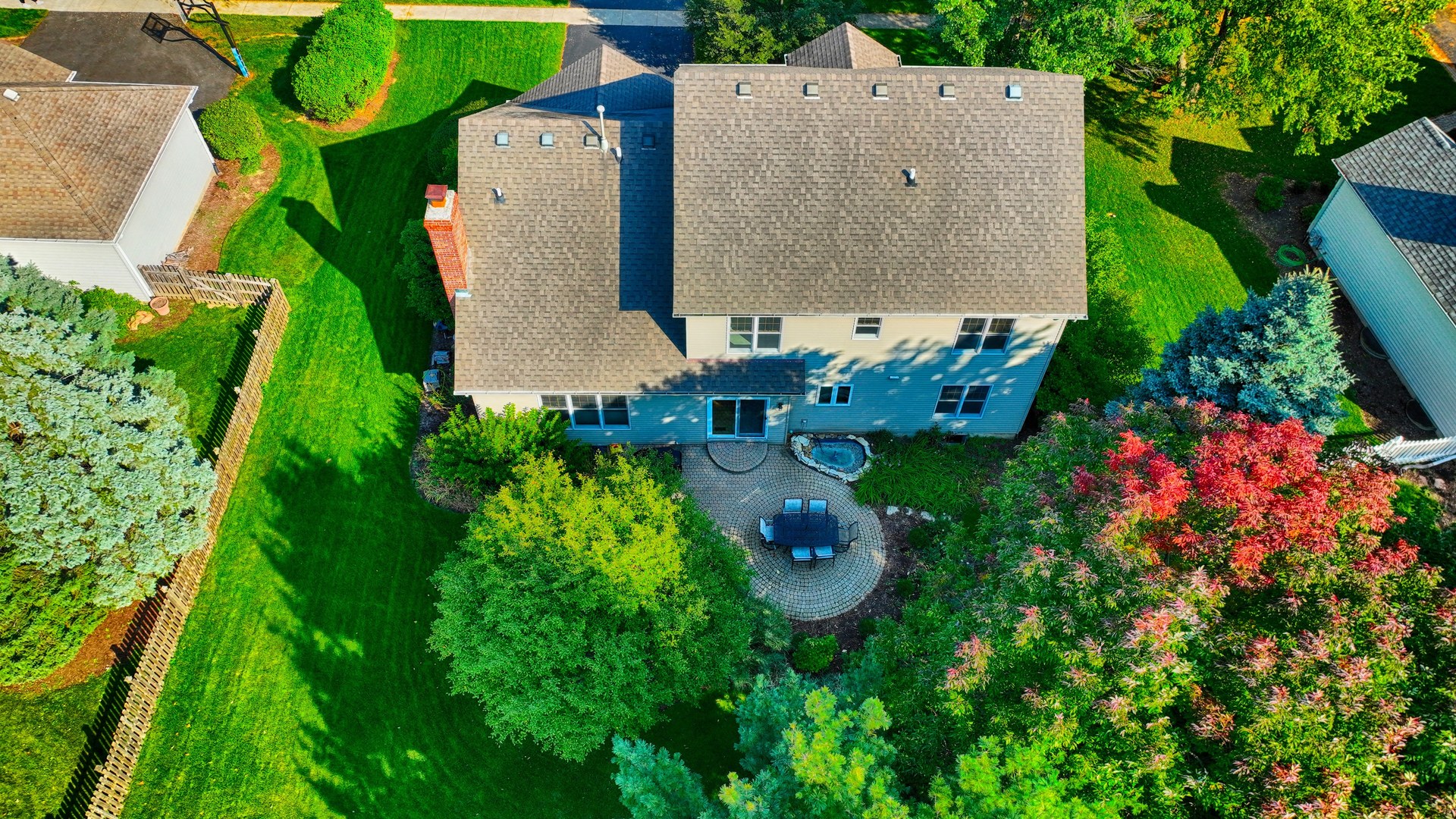 448 Lewis Road Geneva, IL 60134 - Photo 50 of 52 an aerial view of a house with a yard and trees all around