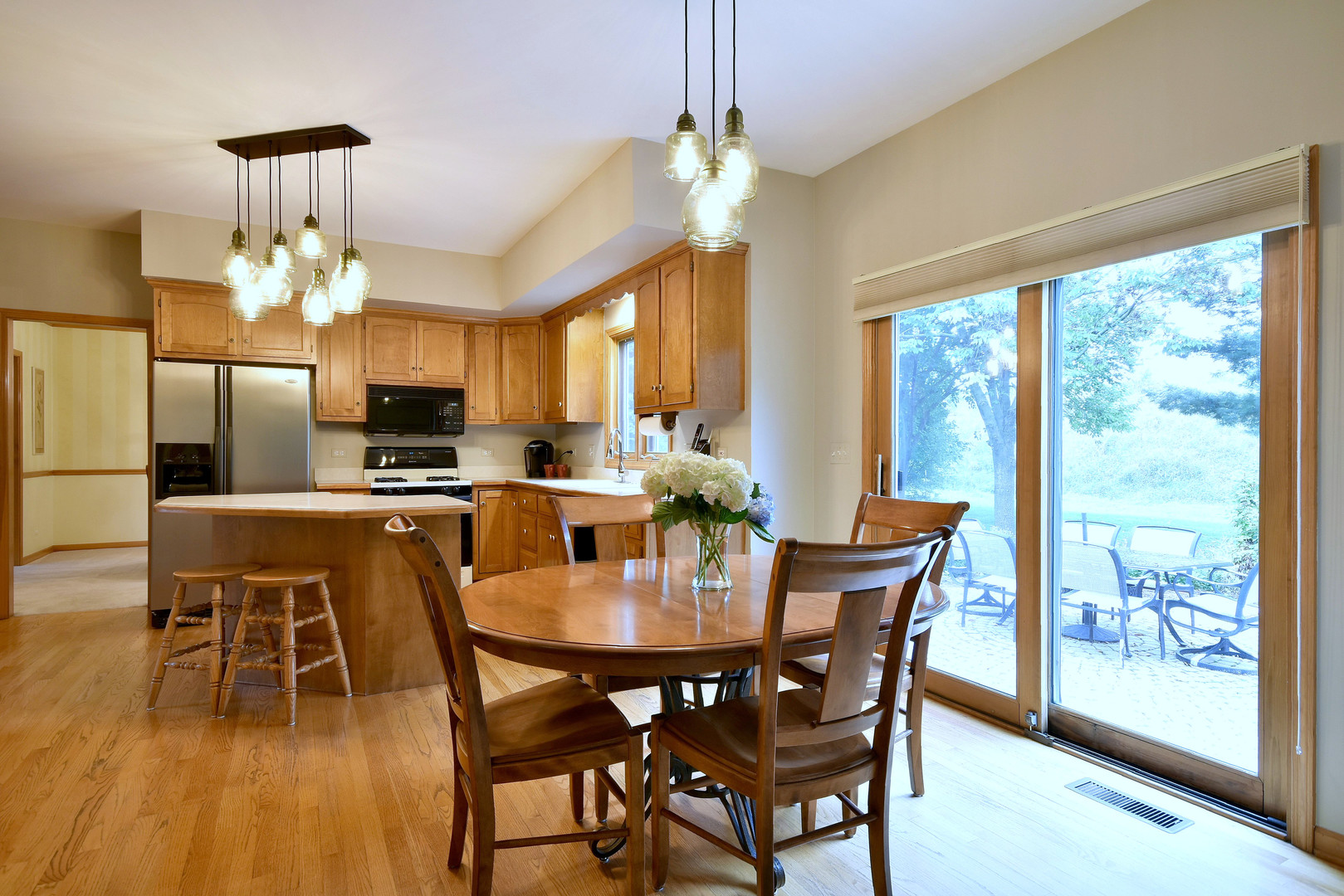 448 Lewis Road Geneva, IL 60134 - Photo 10 of 52 a view of a dining room with furniture window and wooden floor