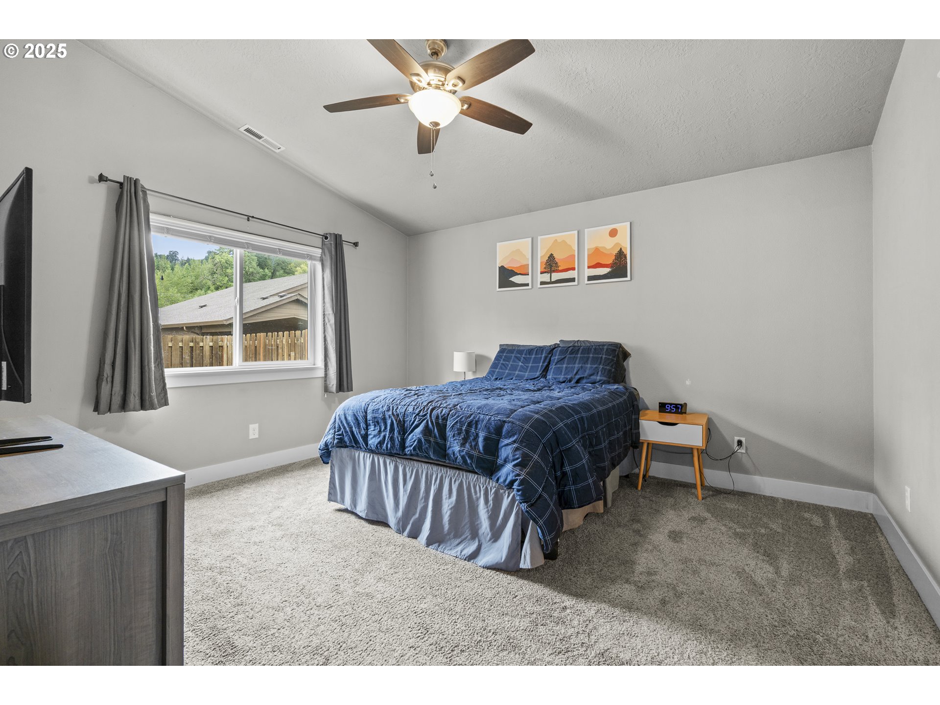 2474 Equestrian Loop South Salem, OR 97302 - Photo 12 of 23 a bedroom with a bed and a flat screen tv