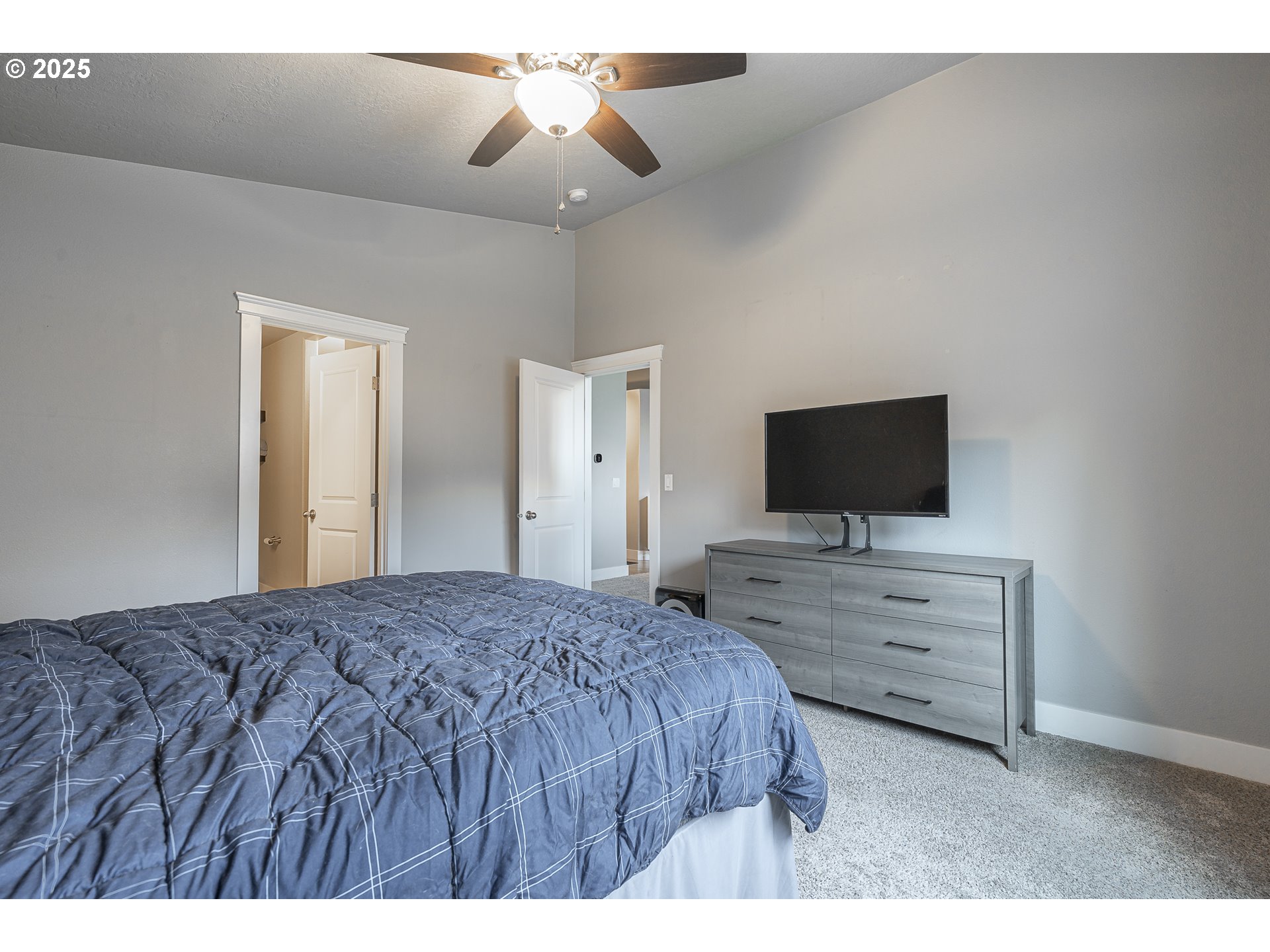 2474 Equestrian Loop South Salem, OR 97302 - Photo 13 of 23 a bedroom with a bed and a flat screen tv
