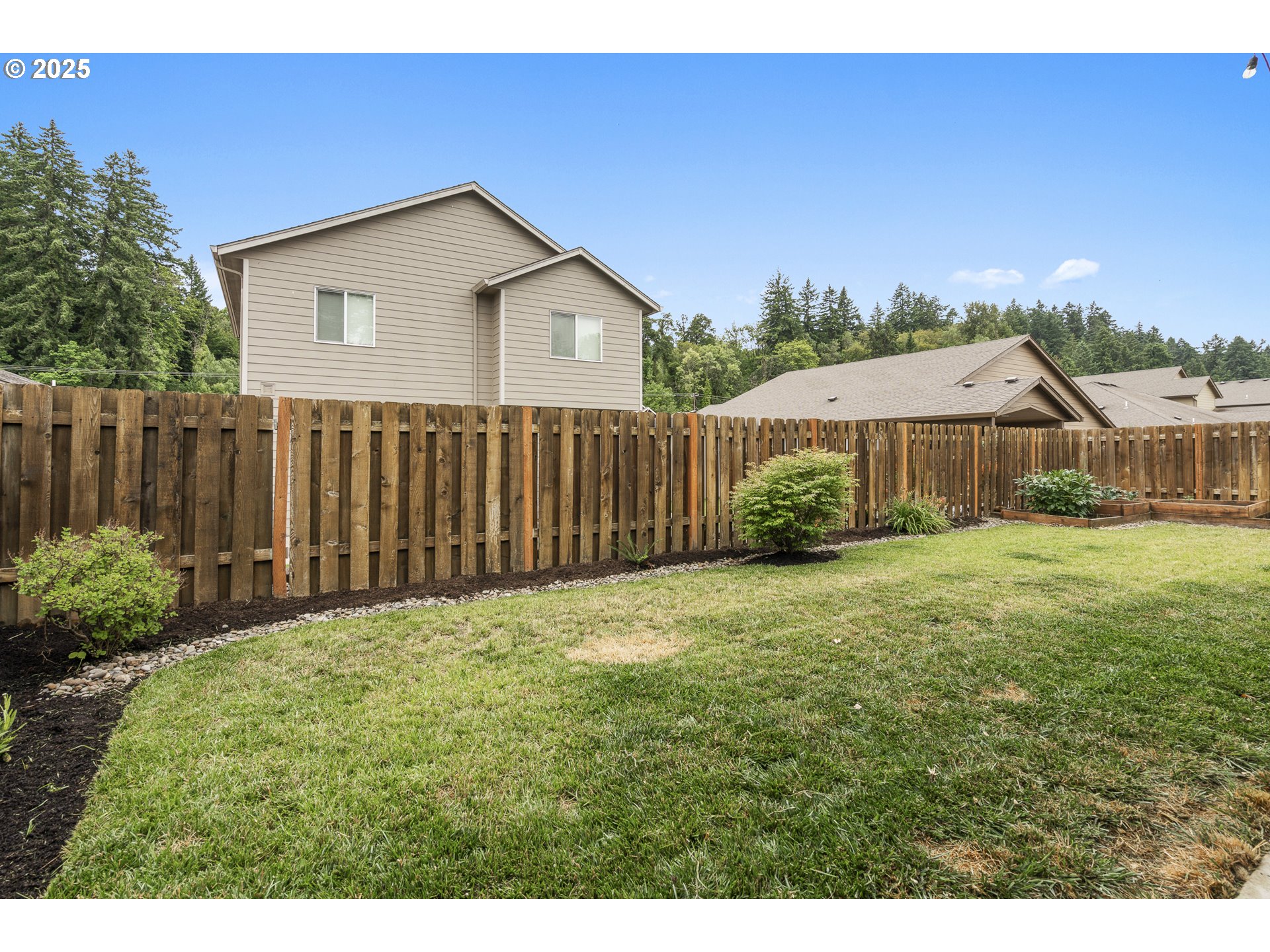 2474 Equestrian Loop South Salem, OR 97302 - Photo 20 of 23 a front view of a house with garden