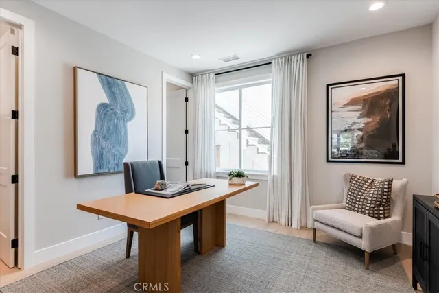 a view of a livingroom with furniture and a table