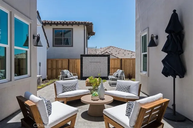 a view of a dining room with furniture and a floor to ceiling window