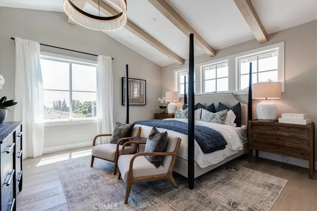 a bedroom with bed and a window