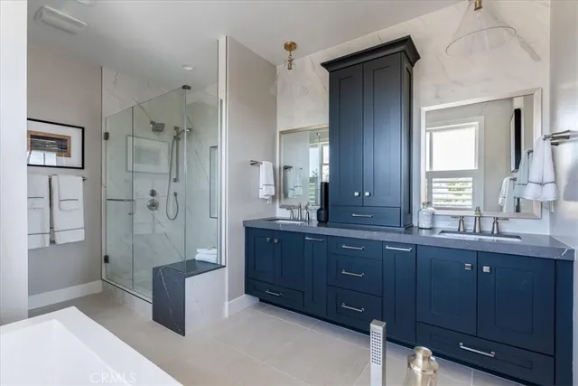a bathroom with a granite countertop sink mirror and double
