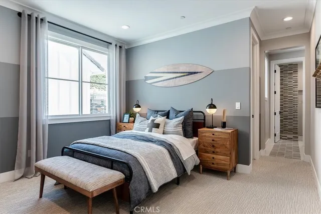 a bedroom with bed and a window