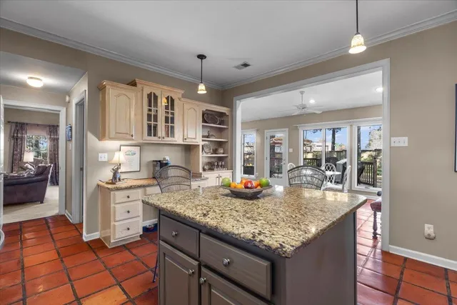 a kitchen with stainless steel appliances granite countertop a stove and cabinets