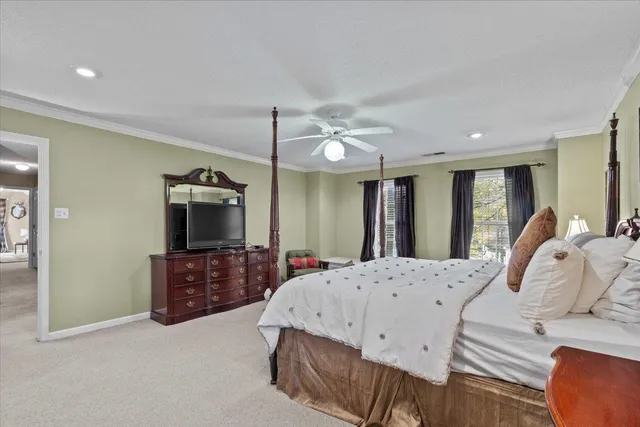 a bedroom with a bed and a flat screen television