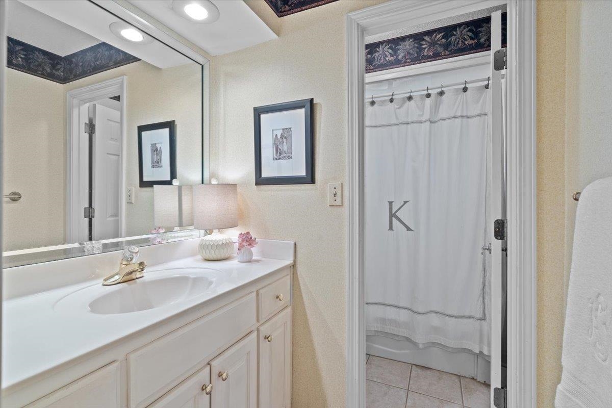 732 North Tree Drive Collierville, TN 38017 - Photo 28 of 40 Full bathroom with vanity, light tile patterned flooring, and curtained shower